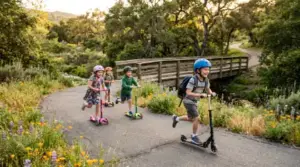Kids riding scooters on trail